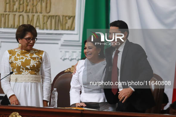 Outgoing Mexico City Head of Government Marti Batres and incoming Mexico City Head of Government Clara Brugada Molina participate in the swe...