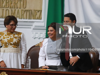 Outgoing Mexico City Head of Government Marti Batres and incoming Mexico City Head of Government Clara Brugada Molina participate in the swe...