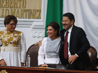 Outgoing Mexico City Head of Government Marti Batres and incoming Mexico City Head of Government Clara Brugada Molina participate in the swe...