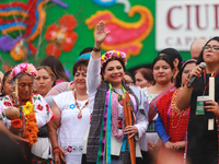 Incoming Mexico City Chief of Government Clara Brugada Molina receives the baton of command from representatives of indigenous peoples durin...