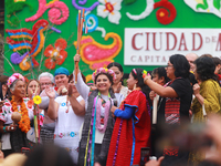 Incoming Mexico City Chief of Government Clara Brugada Molina receives the baton of command from representatives of indigenous peoples durin...