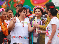 Incoming Mexico City Chief of Government Clara Brugada Molina receives the baton of command from representatives of indigenous peoples durin...