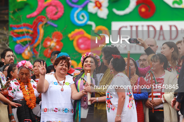 Incoming Mexico City Chief of Government Clara Brugada Molina receives the baton of command from representatives of indigenous peoples durin...