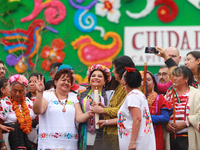 Incoming Mexico City Chief of Government Clara Brugada Molina receives the baton of command from representatives of indigenous peoples durin...