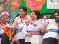 Incoming Mexico City Chief of Government Clara Brugada Molina receives the baton of command from representatives of indigenous peoples durin...