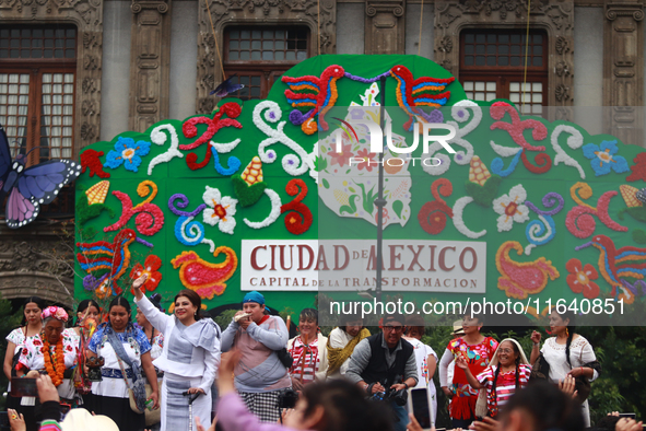 Incoming Mexico City Chief of Government Clara Brugada Molina receives the baton of command from representatives of indigenous peoples durin...