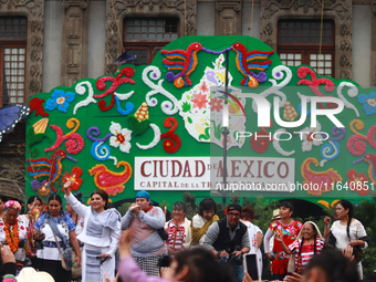 Incoming Mexico City Chief of Government Clara Brugada Molina receives the baton of command from representatives of indigenous peoples durin...