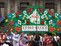 Incoming Mexico City Chief of Government Clara Brugada Molina receives the baton of command from representatives of indigenous peoples durin...