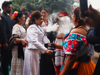 Incoming Mexico City Chief of Government Clara Brugada Molina receives the baton of command from representatives of indigenous peoples durin...