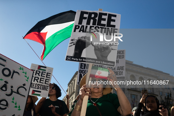 People demonstrate for ceasefires in Palestine and Lebanon at the White House in Washington, DC, on October 5, 2024. The protest is one of m...