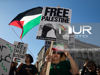 People demonstrate for ceasefires in Palestine and Lebanon at the White House in Washington, DC, on October 5, 2024. The protest is one of m...