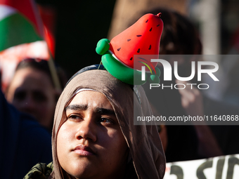 People demonstrate for ceasefires in Palestine and Lebanon at the White House in Washington, DC, on October 5, 2024. The protest is one of m...