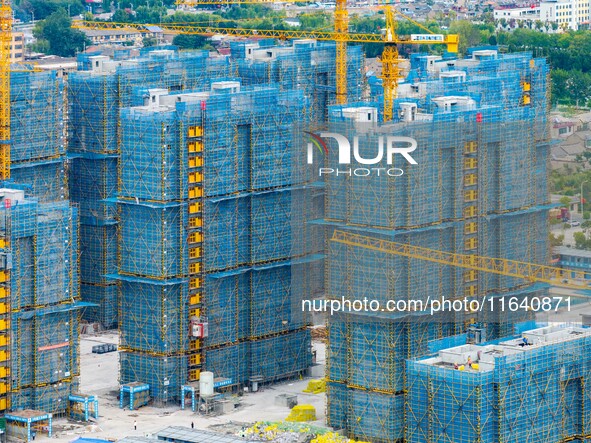 A real estate project is under construction in Huai'an District, Huai'an City, Jiangsu Province, China, on October 5, 2024. 