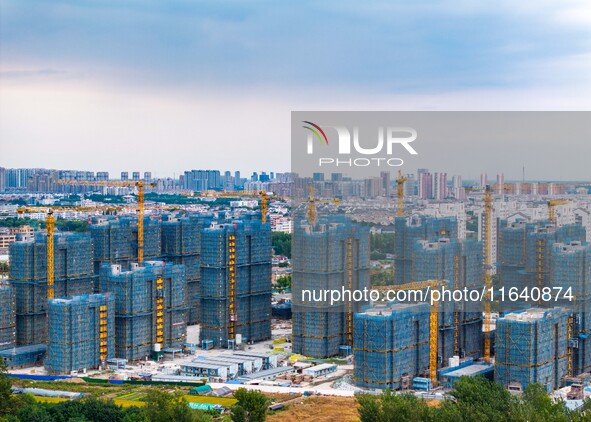 A real estate project is under construction in Huai'an District, Huai'an City, Jiangsu Province, China, on October 5, 2024. 