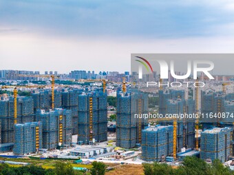 A real estate project is under construction in Huai'an District, Huai'an City, Jiangsu Province, China, on October 5, 2024. (