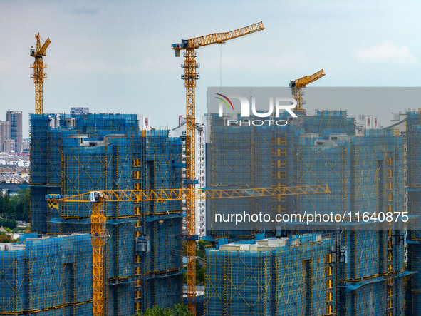 A real estate project is under construction in Huai'an District, Huai'an City, Jiangsu Province, China, on October 5, 2024. 