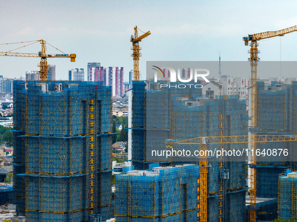 A real estate project is under construction in Huai'an District, Huai'an City, Jiangsu Province, China, on October 5, 2024. 