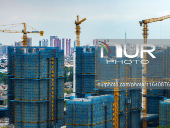 A real estate project is under construction in Huai'an District, Huai'an City, Jiangsu Province, China, on October 5, 2024. (