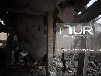 A Palestinian inspects the damage to a mosque after it is hit in an Israeli strike in Deir al-Balah, central Gaza Strip, on October 6, 2024,...