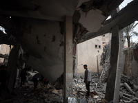 A Palestinian inspects the damage to a mosque after it is hit in an Israeli strike in Deir al-Balah, central Gaza Strip, on October 6, 2024,...