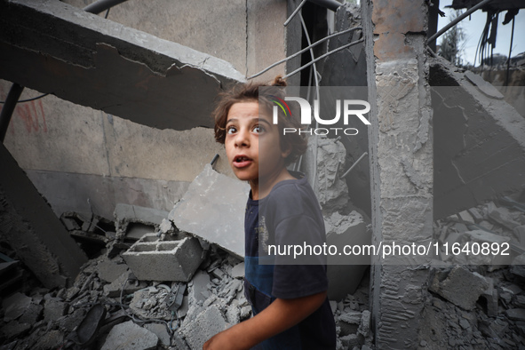 A Palestinian inspects the damage to a mosque after it is hit in an Israeli strike in Deir al-Balah, central Gaza Strip, on October 6, 2024,...