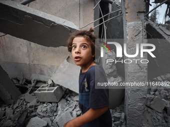 A Palestinian inspects the damage to a mosque after it is hit in an Israeli strike in Deir al-Balah, central Gaza Strip, on October 6, 2024,...