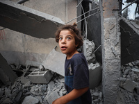 A Palestinian inspects the damage to a mosque after it is hit in an Israeli strike in Deir al-Balah, central Gaza Strip, on October 6, 2024,...