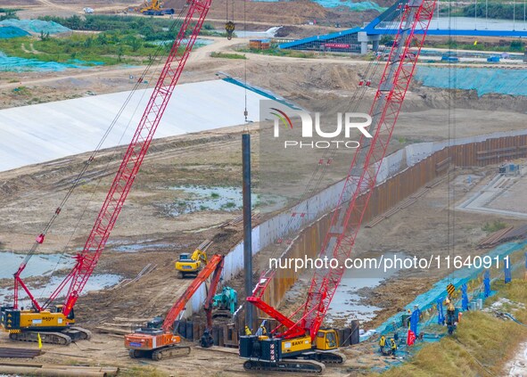 Workers work at the construction site of the Huaian Junction project of the second phase of the Huaihe River Waterway into the sea in Huai'a...