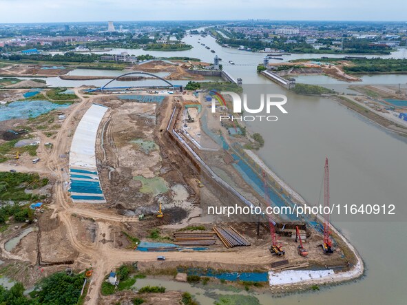 Workers work at the construction site of the Huaian Junction project of the second phase of the Huaihe River Waterway into the sea in Huai'a...