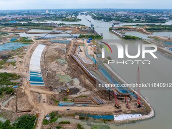 Workers work at the construction site of the Huaian Junction project of the second phase of the Huaihe River Waterway into the sea in Huai'a...