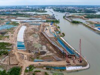 Workers work at the construction site of the Huaian Junction project of the second phase of the Huaihe River Waterway into the sea in Huai'a...