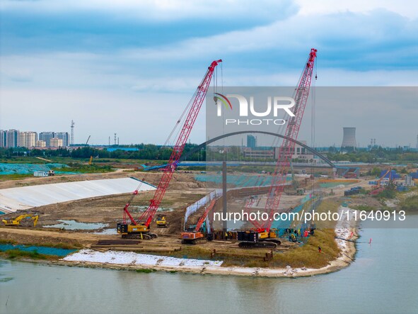 Workers work at the construction site of the Huaian Junction project of the second phase of the Huaihe River Waterway into the sea in Huai'a...