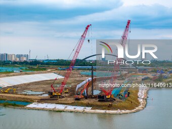 Workers work at the construction site of the Huaian Junction project of the second phase of the Huaihe River Waterway into the sea in Huai'a...