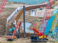 Workers work at the construction site of the Huaian Junction project of the second phase of the Huaihe River Waterway into the sea in Huai'a...