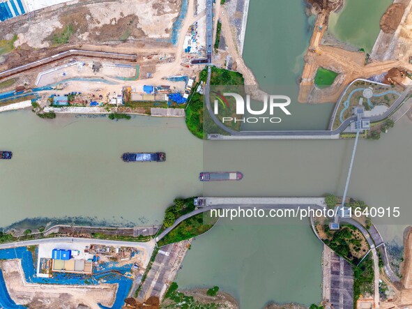 Workers work at the construction site of the Huaian Junction project of the second phase of the Huaihe River Waterway into the sea in Huai'a...