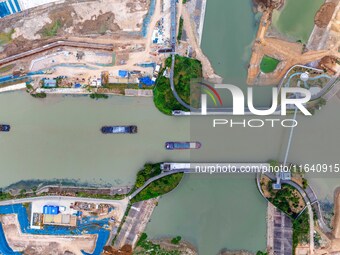 Workers work at the construction site of the Huaian Junction project of the second phase of the Huaihe River Waterway into the sea in Huai'a...