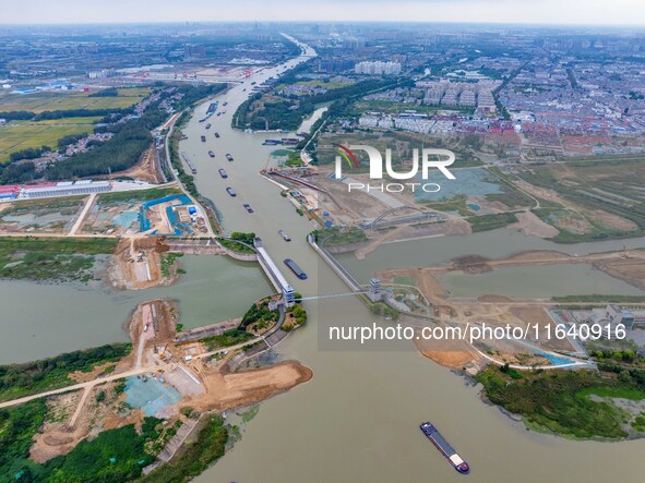 Workers work at the construction site of the Huaian Junction project of the second phase of the Huaihe River Waterway into the sea in Huai'a...