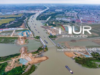 Workers work at the construction site of the Huaian Junction project of the second phase of the Huaihe River Waterway into the sea in Huai'a...