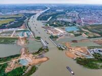 Workers work at the construction site of the Huaian Junction project of the second phase of the Huaihe River Waterway into the sea in Huai'a...