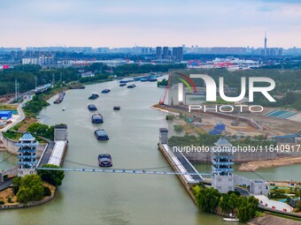 Workers work at the construction site of the Huaian Junction project of the second phase of the Huaihe River Waterway into the sea in Huai'a...