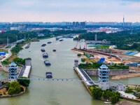 Workers work at the construction site of the Huaian Junction project of the second phase of the Huaihe River Waterway into the sea in Huai'a...