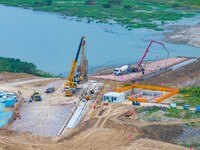 Workers work at the construction site of the Huaian Junction project of the second phase of the Huaihe River Waterway into the sea in Huai'a...