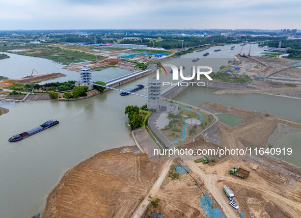 Workers work at the construction site of the Huaian Junction project of the second phase of the Huaihe River Waterway into the sea in Huai'a...