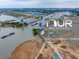 Workers work at the construction site of the Huaian Junction project of the second phase of the Huaihe River Waterway into the sea in Huai'a...