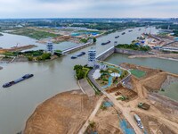 Workers work at the construction site of the Huaian Junction project of the second phase of the Huaihe River Waterway into the sea in Huai'a...