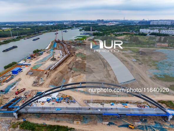 Workers work at the construction site of the Huaian Junction project of the second phase of the Huaihe River Waterway into the sea in Huai'a...