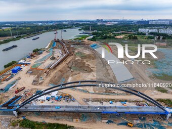 Workers work at the construction site of the Huaian Junction project of the second phase of the Huaihe River Waterway into the sea in Huai'a...