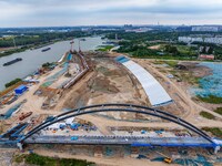 Workers work at the construction site of the Huaian Junction project of the second phase of the Huaihe River Waterway into the sea in Huai'a...