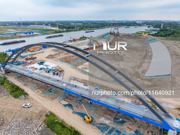 Workers work at the construction site of the Huaian Junction project of the second phase of the Huaihe River Waterway into the sea in Huai'a...