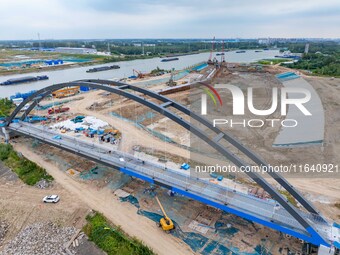 Workers work at the construction site of the Huaian Junction project of the second phase of the Huaihe River Waterway into the sea in Huai'a...